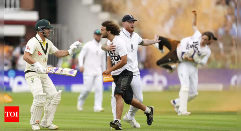 Watch: Protestors briefly disrupt 2nd Ashes Test; Jonny Bairstow carries invader off the field | Cricket News – Times of India