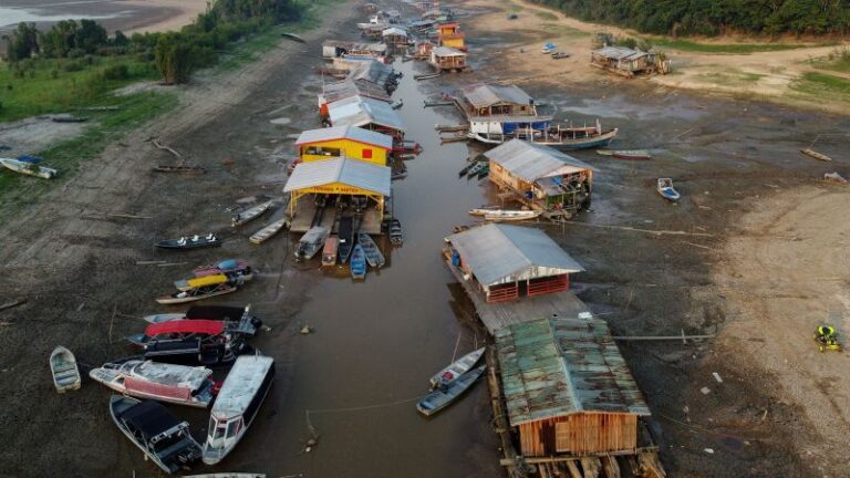 A floating village is stranded on a dry lakebed as extreme drought grips the Amazon | CNN