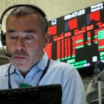 Stocks pare losses as oil falls back below $100; Dow is down 350 points: Live updates