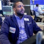 Stock futures fall after Dow retakes 50,000: Live updates