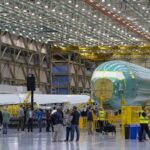 Boeing narrows third-quarter loss as defense sales rise, but focus remains on 737 Max production
