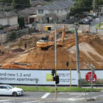 An Australian developer says a rail project halted its 218-apartment build after the state moved to acquire underground land; with more than 100 buyers waiting, it is suing for at least A$100 million